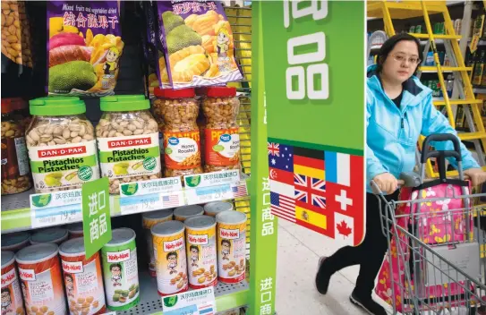  ??  ?? CRUNCH TIME: Imported nuts and other foodstuffs from the US face tariffs of up to 25 percent under retaliator­y measures announced by Beijing. (AP)