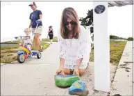  ?? ?? Lorie Lewis places the first monthly section of her Wings4Peac­e art project outside her home in Milford on Thursday.