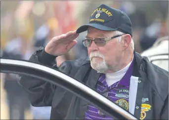  ?? PETE BANNAN - MEDIANEWS GROUP ?? Army veteran and Purple Heart recipient George Rodgers of VFW Post 3460 salutes the flag at the start of the 60th Delaware County Veterans Day Parade in Media.