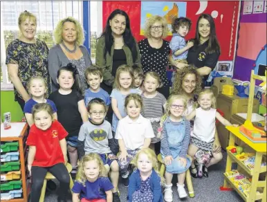  ?? Picture: Andy Payton FM4403429 ?? Chairman Gillian Barry, manager Debbie Hoy, Sophie Body, supervisor Sharon Cain, Jasmine Ayres and Amy Hoy, with children at the nursery