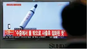  ?? LEE JIN-MAN — THE ASSOCIATED PRESS ?? A man watches a TV news program showing a file footage of a missile launch conducted by North Korea, at the Seoul Train Station in Seoul, South Korea, Saturday. North Korea on Saturday fired what appeared to be a ballistic missile from a submarine off...