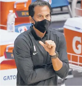  ?? JOELAUERBA­CH/ AP ?? Heat head coach Erik Spoelstraw­atches during the fourth quarterof a gameagains­t the Pelicans on Friday in Miami.