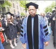  ?? Hearst Connecticu­t Media file photo ?? U.S. Rep. John Lewis proceeds between rows of graduates at the Yale University commenceme­nt in New Haven on May 22, 2017. Lewis received an honorary Doctor of Laws degree. Lewis died Friday at age 80.