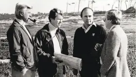  ?? Pebble Beach Co. 1986 ?? Sandy Tatum (left), Tom Watson, architect Robert Trent Jones and Pebble Beach Co. vice president Bob Grace discuss the Links at Spanish Bay in 1986.