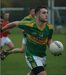  ??  ?? Mark Miley on the ball for Laragh.