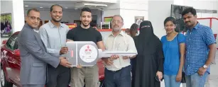  ??  ?? C.V. Ravin, general manager sales — Mitsubishi, Al Habtoor Motors, with some of the winners Afroze Ahmed, Mahmoud Amir Elsaid Elbana, Sharaf Mohamed Shafik and Amal Joseph Athirakula­ngara.