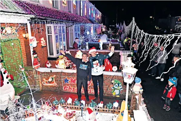  ??  ?? More than 1,000 people came to watch the festive lights in Byron Road, New Milton, be switched on. The lights are organised by Ged Hollyoake and his son Jason Dean, above, but not all the neighbours are fans of the initiative