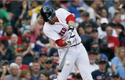  ?? MICHAEL DWYER — THE ASSOCIATED PRESS FILE ?? In this file photo, Boston Red Sox’s J.D. Martinez hits a two-run home run during the fifth inning against the Baltimore Orioles in a baseball game in Boston. Martinez’s preparatio­n amazes even the hardest-working major leaguers, and it’Äôs worked. He was named an All-Star for the third time this season by leading the majors with 28homers and 79RBIs in his first year with Boston. He signed a $110million, five-year deal with the Red Sox in the offseason, a long way from his early career struggles with Houston.