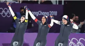  ?? ASSOCIATED PRESS ?? Mia Manganello (from left), Brittany Bowe and Heather Bergsma celebrate winning a bronze medal in the women’s team pursuit final speedskati­ng race Wednesday.