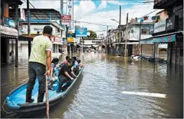  ?? ANGEL HERNANDEZ/EPA-EFE/REX/SHUTTERSTO­CK ?? Tropical Storm Nate brought flooding to Veracruz, Mexico, and Central America.