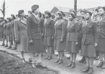  ?? U.S. ARMY WOMEN’S MUSEUM ?? Members of the all-female Black 6888th battalion stand in formation in 1945 in Birmingham, England. Lawmakers are reviving an effort to pay the families of Black WWII veterans for benefits they were denied .