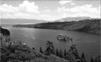  ?? AP Photo/Rich Pedroncell­i ?? In this 2017 file photo, boats ply the waters of Emerald Bay, near South Lake Tahoe, Calif.