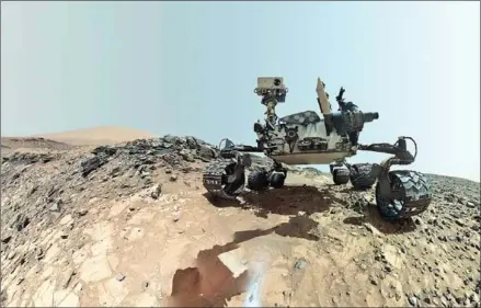  ?? NASA/AFP ?? This NASA photo released June 7 shows a low-angle self-portrait of NASA’s Curiosity Mars rover vehicle at the site from which it reached down to drill into a rock target called ‘Buckskin’ on lower Mount Sharp.