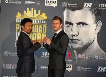  ?? PHOTO: BEN DREWE ?? TOP FIGHT: Legendary boxer Manny Pacquiao faces off with Brisbane boxer Jeff Horn at the media conference ahead of the Battle of Brisbane boxing bout on July 2.