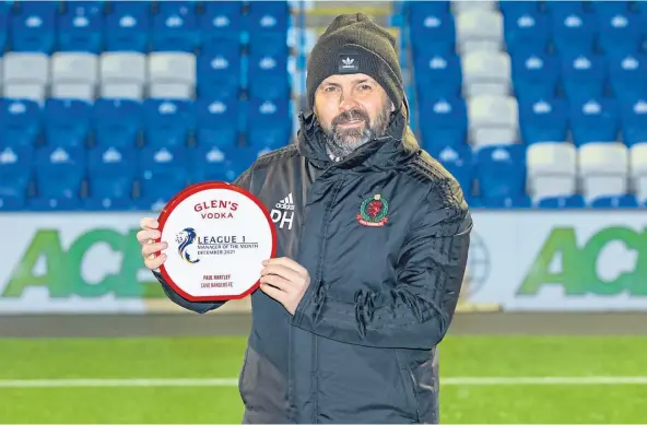  ?? ?? FAMOUS DOUBLE: Cove Rangers’ Paul Hartley collects the League 1 manager award for the second consecutiv­e month.