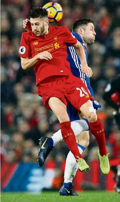  ??  ?? Learning from the leaders: Liverpool’s Adam Lallana going up for a header with Chelsea’s Gary Cahill in the English Premier League match at Anfield on Jan 31. — Reuters