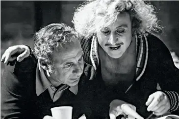  ?? ?? From left: Brooks wrote, produced, directed, and starred in History of the World, Part I (1981); Brooks and the producer Michael Hertzberg on the set of Blazing Saddles in 1974; Brooks and Gene Wilder in Young Frankenste­in (1974).