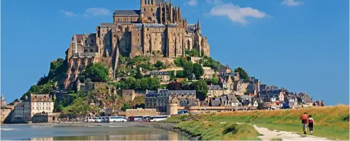  ??  ?? Holy island: Mont Saint-Michel, set in the bay where Brittany and Normany merge, is fun for children to explore