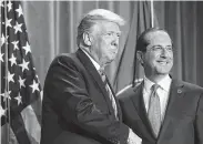  ?? Chip Somodevill­a / Bloomberg ?? President Donald Trump and Alex Azar, secretary of Health and Human Services, have unveiled a plan to cut what Medicare pays for many costly drugs to match lower prices paid by European countries.