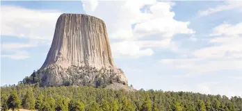  ?? DREAMSTIME ?? Notably featured in the classic sci-fi film “Close Encounters of the Third Kind,” Devils Tower in northeaste­rn Wyoming is worth traveling to even if you’re not being summoned there by aliens.