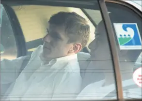  ?? Patrick Semansky / Associated Press ?? James O’Keefe, left, and Stan Dai leave St. Bernard Parish jail in a taxi cab in Chalmette, La., in 2010. O’Keefe, a conservati­ve activist, is scheduled to speak in Shelton at an event hosted by the Connecticu­t Republican Party.