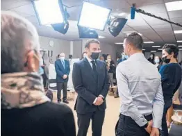  ?? LOIC VENANCE/ GETTY- AFP ?? French President Emmanuel Macron meets employees Tuesday at the family allowance public service in Tours, in central France.