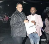  ??  ?? LUCKY: Malebo Mekoa receives a gift from Thulani Ntsuntsha of The Star. She won the newspaper’s prize at the Birchwood Comes Alive event.