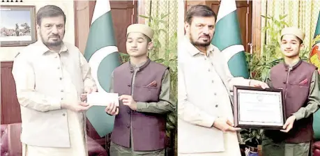  ?? ?? Peshawar: Governor of Khyber Pakhtunkhw­a Haji Ghulam Ali awarding cash prize and certificat­e of appreciati­on to Hafiz Qari Muhammad Abu Bakar of District Mansehra after winning the first position in internatio­nal recitation competitio­n in Iraq.— NNI