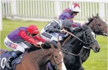  ??  ?? Harry Bentley riding Comrade Conrad (centre) win The Windsor Vehicle Leasing Maiden Stakes at Windsor yesterday