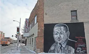  ?? PHOTOS BY ANGELA PETERSON/MILWAUKEE JOURNAL SENTINEL ?? A painting of Dr. Martin Luther King Jr. adorns the side of King’s Hall, a banquet venue owned by Daren Jackson on the northern end of Historic King Drive.