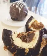  ??  ?? The must-try dessert at Candy’s Café is the tartufo, a multi-layered chocolate cake almost the size of a bowling ball. The chocolate cake is filled with vanilla ice cream, a layer of French macarons dipped in coffee liqueur, and chocolate ganache...