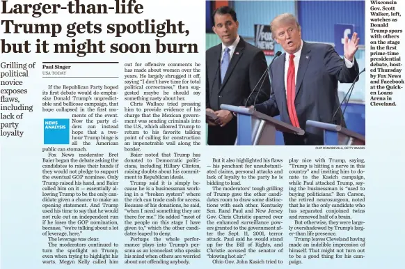  ?? CHIP SOMODEVILL­A, GETTY IMAGES ?? Wisconsin Gov. Scott Walker, left, watches as Donald Trump spars with others on the stage in the first prime-time presidenti­al debate, hosted Thursday by Fox News and Facebook at the Quicken Loans Arena in Cleveland.