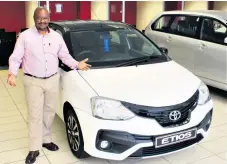  ??  ?? McCarthy Toyota Empangeni Sales Executive, Wilfred Ximba, showing off the new Etios Sport derivative in Glacier White