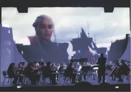  ?? IVP FILE PHOTO / VINCENT OSUNA PHOTO ?? A scene from “Game of Thrones” plays as music from the TV show is performed during Southwest High School Orchestra’s “Night at the Movies” concert at the Jimmie Cannon Theater for the Performing Arts in El Centro, October 4, 2019.