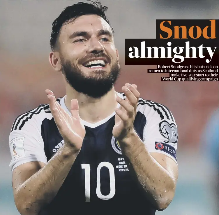  ??  ?? 0 Robert Snodgrass is all smiles at full-time after his three goals helped Scotland to an impressive 5-1 win against Group F rivals Malta at the Ta’qali National Stadium last night.
Match report: Pages 2-3