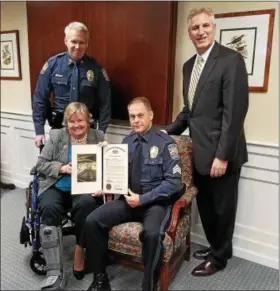  ?? DAN SOKIL — DIGITAL FIRST MEDIA ?? Upper Gwynedd Police Sgt. Steve Gillen, seated at right, is presented his department’s Officer of the Year award and a proclamati­on from the state Legislatur­e by state Rep. Kate Harper, seated, Police Chief David Duffy and state Rep. Todd Stephens.