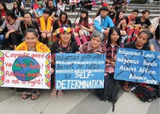  ?? Photo by Milo Brioso ?? IP RIGHTS. Indigenous peoples from the Cordillera and Taiwan join forces for a common cause during the celebratio­n of World Indigenous Day at Malcolm square.