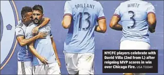  ?? USA TODAY ?? NYCFC players celebrate with David Villa (2nd from l.) after reigning MVP scores in win over Chicago Fire.