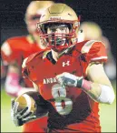  ??  ?? Andrean running back Ryan Walsh gains yards against Kankakee Valley on Friday. Walsh rushed for 155 yards and three touchdowns.
