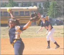  ??  ?? Grace Christian first baseman Tiffany Shrader stands on second base as Riverdale Baptist pitcher Savannah Marshall goes into her delivery in Tuesday’s contest. Grace led several times, but Riverdale eventually departed with an 18-15 victory.