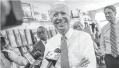  ?? FRANCE PRESSE ?? Former Vice President Joe Biden speaks to the media during a campaign stop with Democratic gubernator­ial candidate Richard Cordray at the Beyond Image Barber Salon.