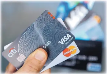  ?? ELISE AMENDOLA/AP ?? The average interest rate on credit cards is around 17 percent and likely to get higher. That makes tackling your highest interest-rate debt close to a top priority.