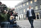  ?? STEFAN ROUSSEAU — PA VIA AP ?? Jeremy Hunt leaves 10 Downing Street in London after he was appointed Chancellor of the Exchequer on Friday.