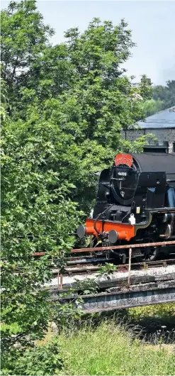  ??  ?? Out with the old… LMS celebrity 4-6-0 Royal Scot travels over the almost life-expired 1904 bridge traversing the River Worth during its summer 2018 visit.