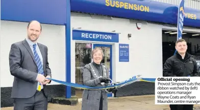  ??  ?? Official opening Provost Simpson cuts the ribbon watched by (left) operations manager Wayne Coats and Ryan Maunder, centre manager