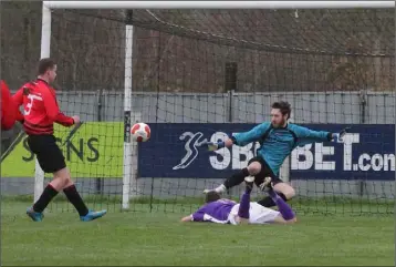  ??  ?? Eugene O’Brien opens the scoring for Wexford against the United Churches Football League.