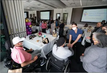 ?? PHOTOS BY DAVID CRANE — STAFF PHOTOGRAPH­ER ?? ABOVE AND BELOW: Visitors attend the launch of the new Los Angeles County Aging and Disabiliti­es Department. It is being lauded as the county's first department dedicated to providing specialize­d services and focus for senior citizens.