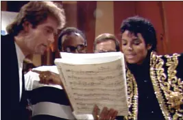  ?? NETFLIX — THE ASSOCIATED PRESS ?? This image released by Netflix shows, from left, Huey Lewis, Quincy Jones and Michael Jackson, right, in a scene from “The Greatest Night in Pop.”