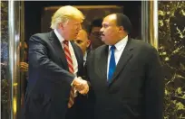  ??  ?? NEW YORK CITY: US President-elect Donald Trump shakes hands with Martin Luther King III after meeting at Trump Tower in New York City on Monday. —AFP