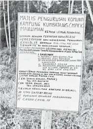  ??  ?? NOTIS: MPKK Kampung Kumbatang Kudat turut memasang papan tanda sebagai notis atau makluman umum agar mematuhi pelaksanaa­n PKP.